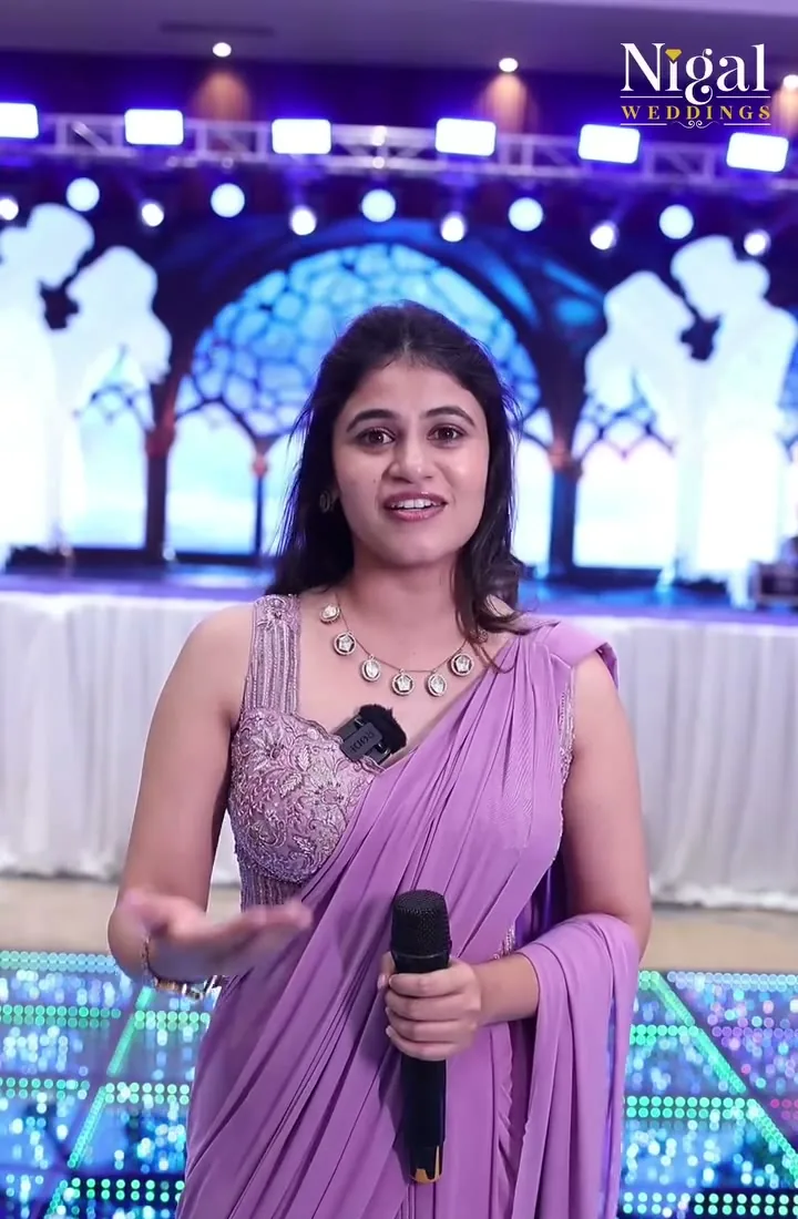 An anchor on stage at a Nigal Events programme
