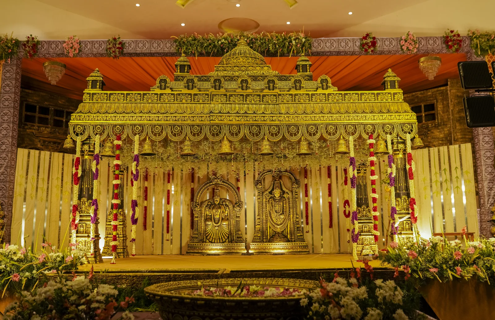 A gold carved mandap built by Nigal Weddings in Tiruchirappalli